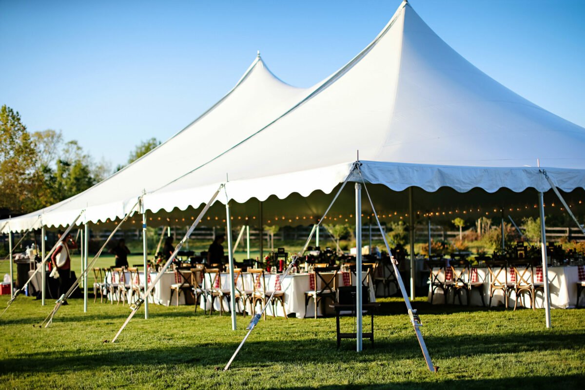 White peg and pole event tent set up outdoors